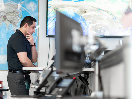 A person monitoring a screen