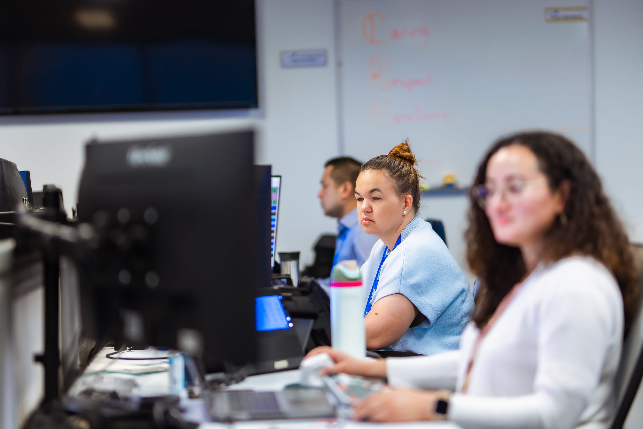 Workers monitoring screens