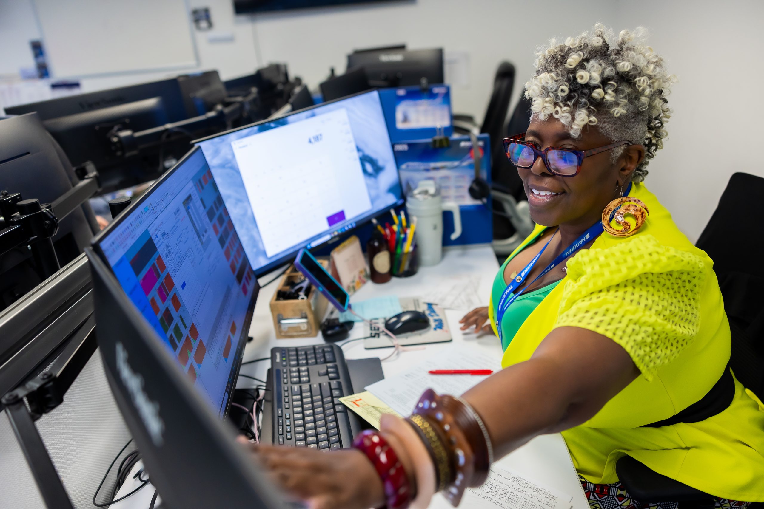 A worker monitoring screens