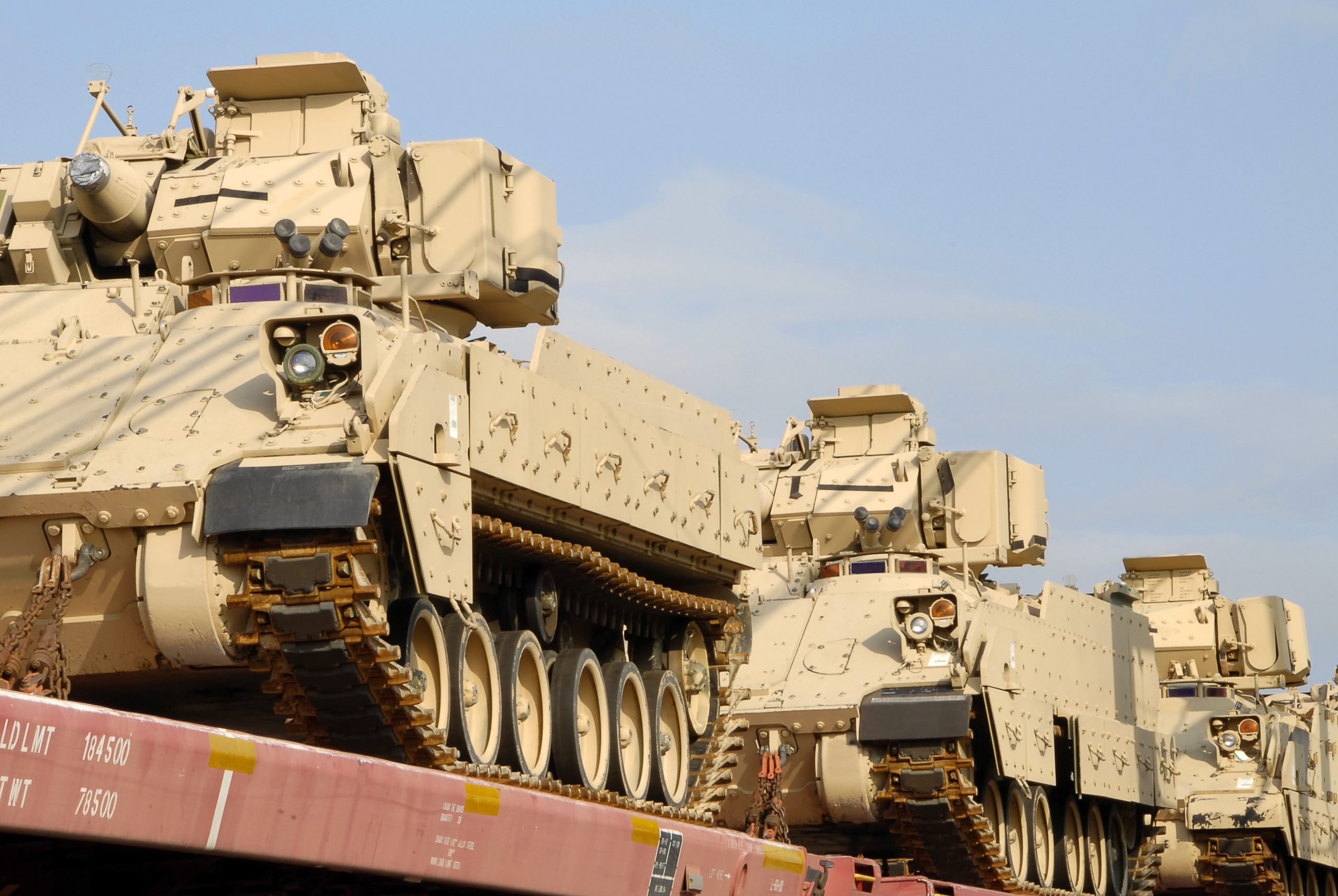 Military vehicles being loaded