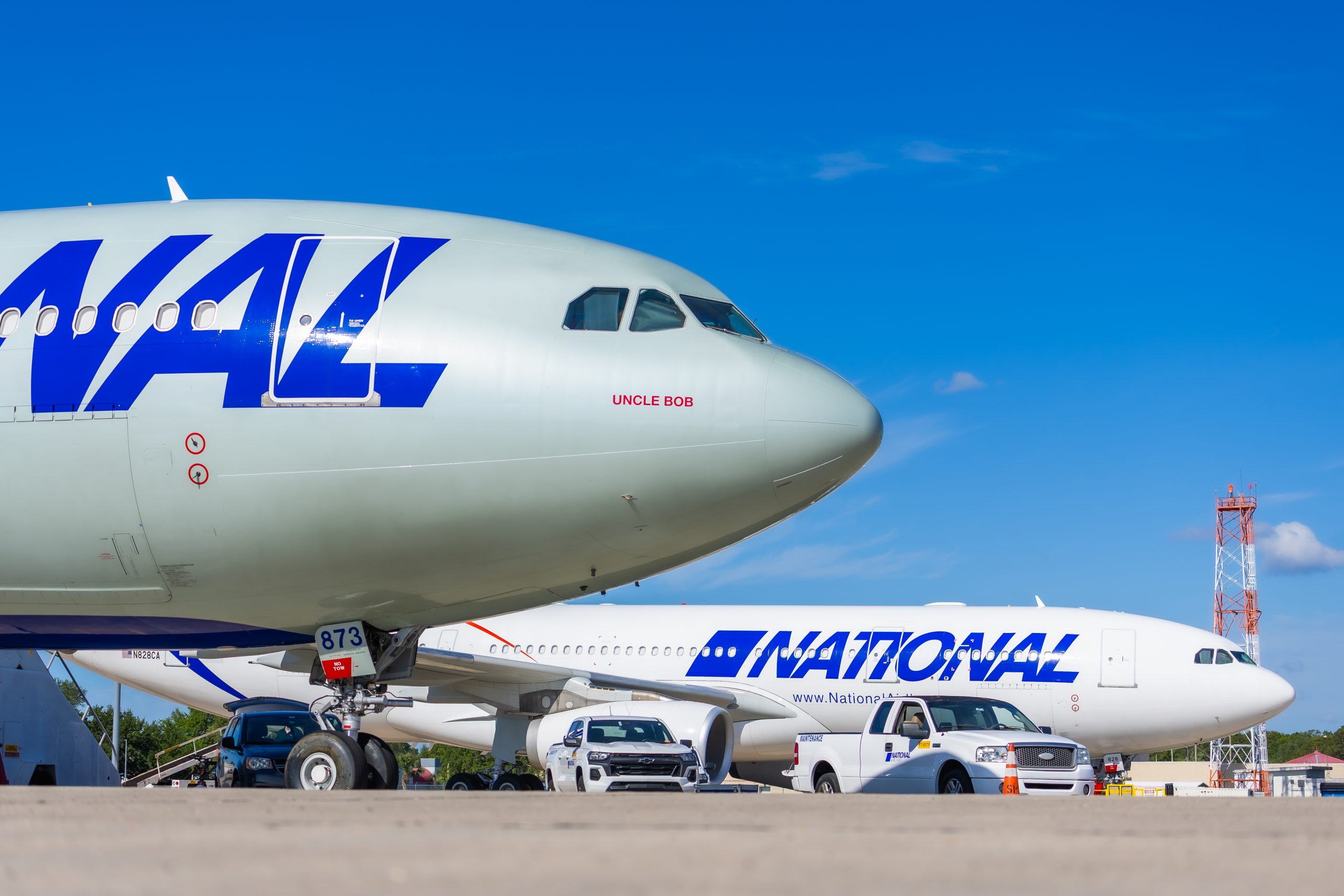 Two airplanes parked beside each other