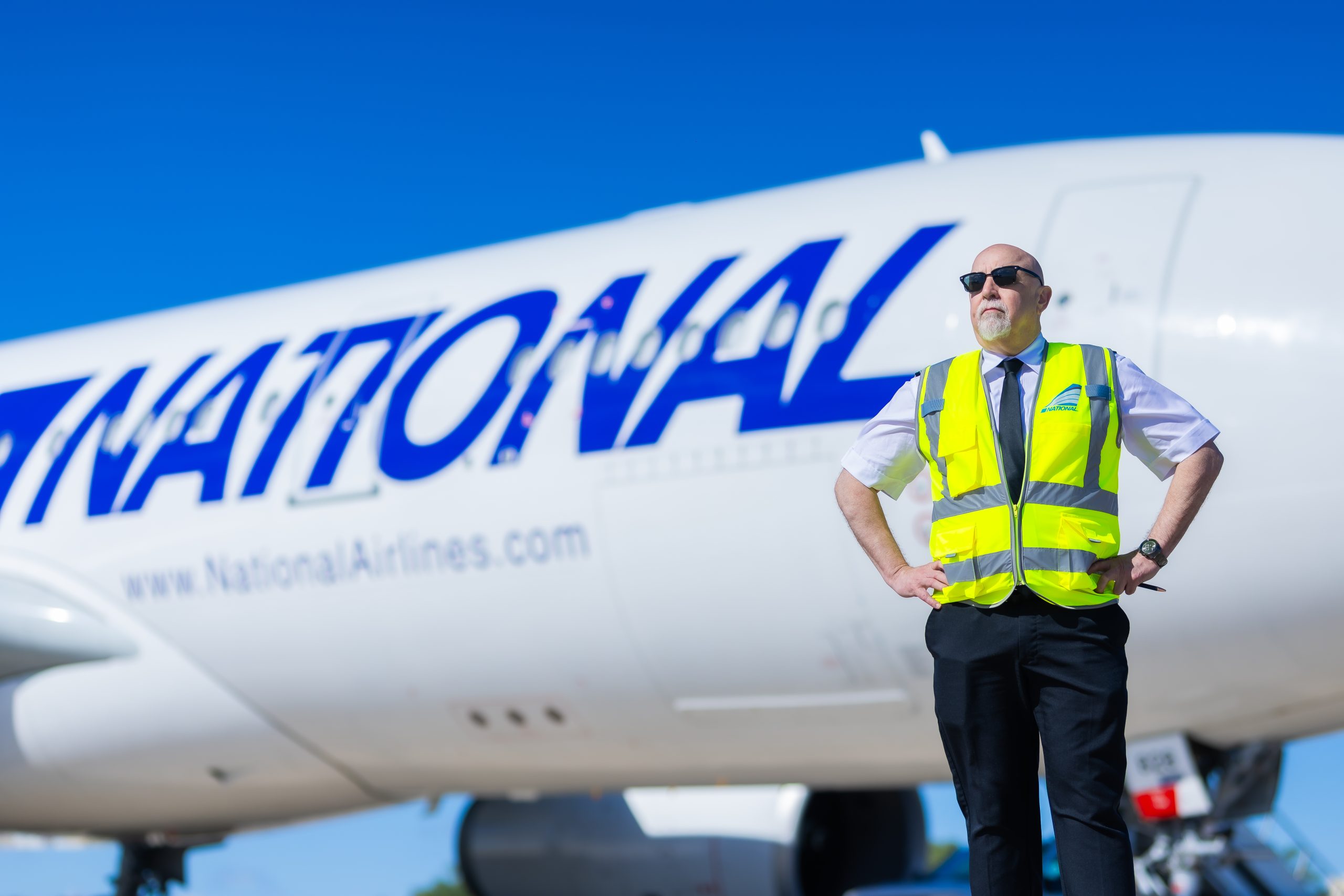 A worker beside an airplane