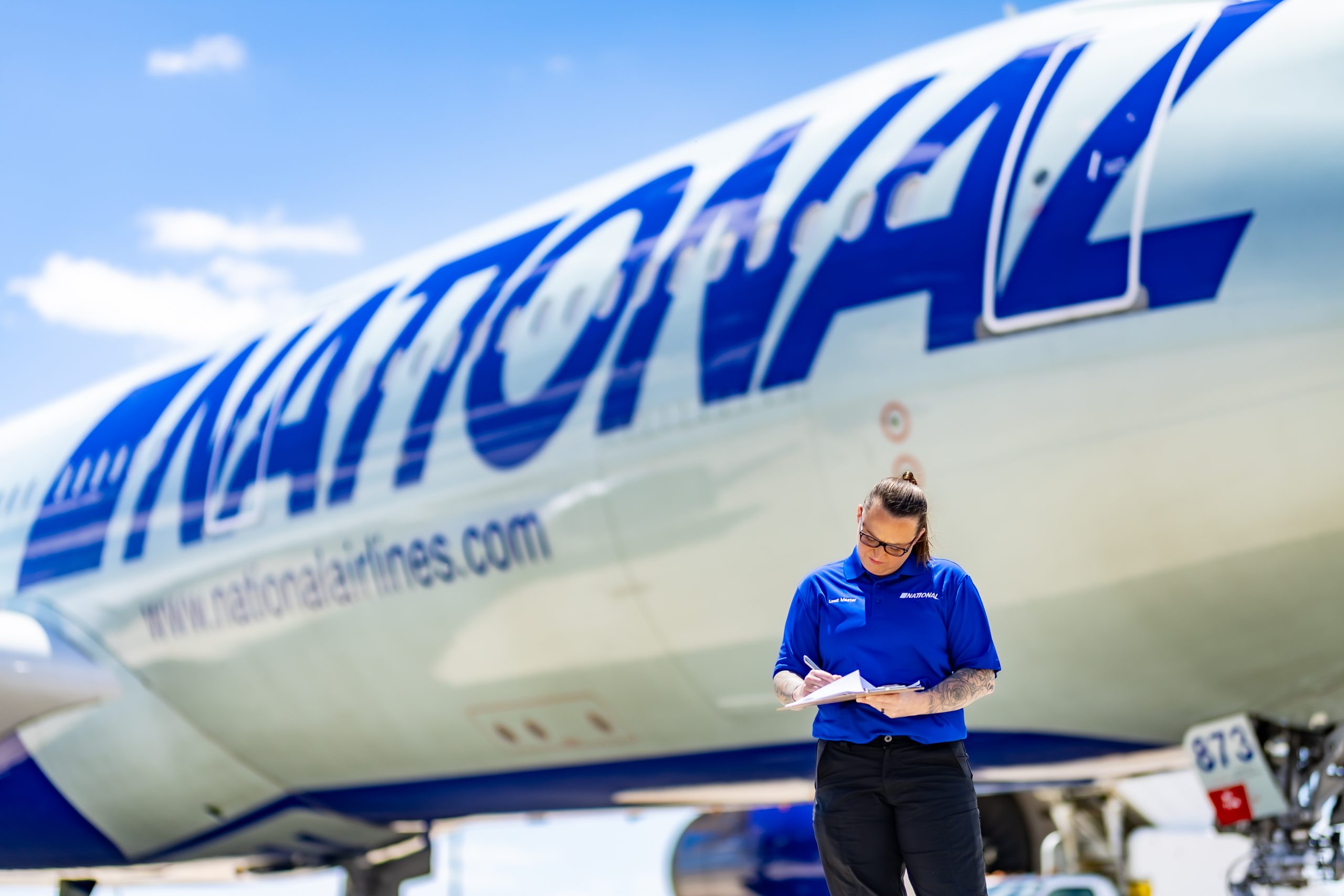 A worker beside an airplane