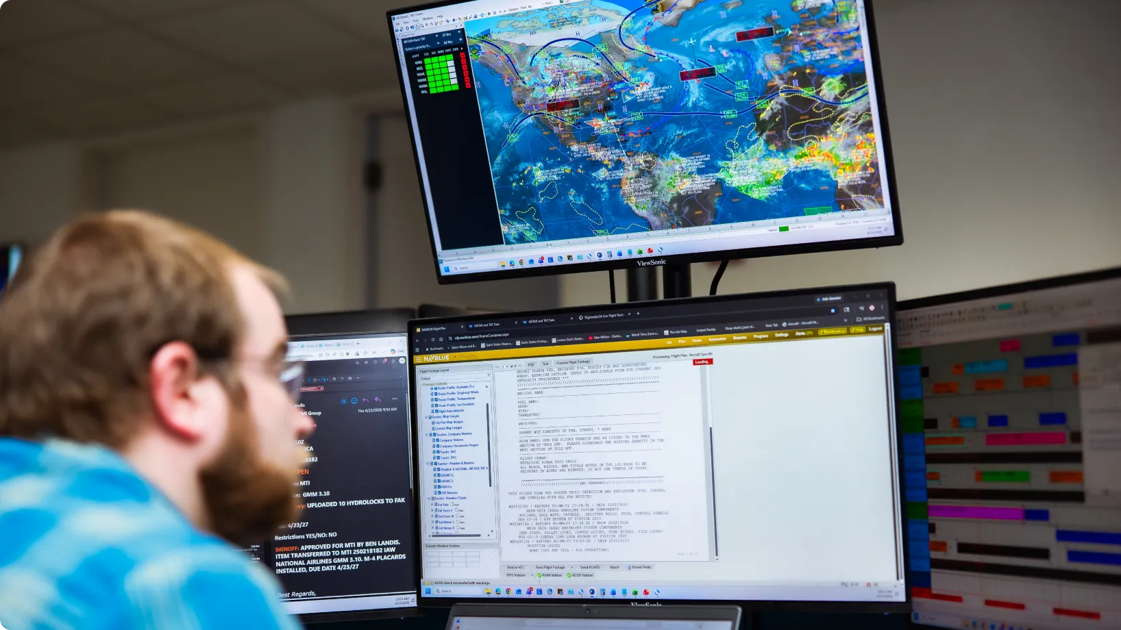 A worker monitoring screens