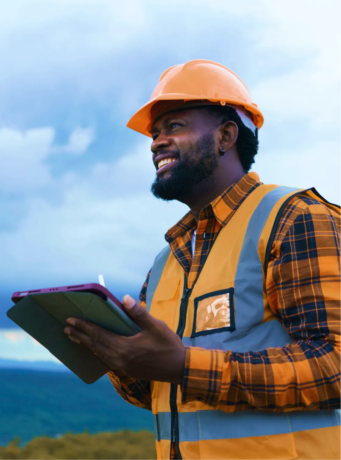 A worker with a tablet device outside