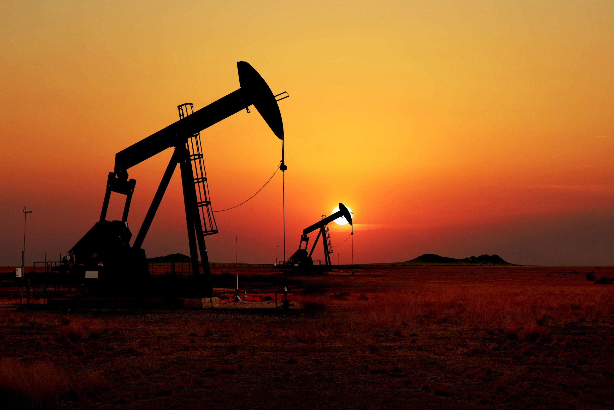 Oil derricks at dusk
