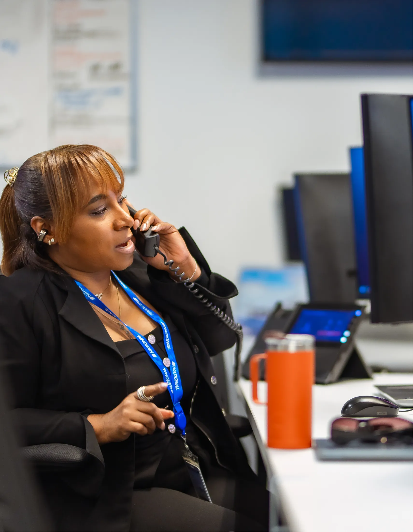 A person talking on the phone in an office environment