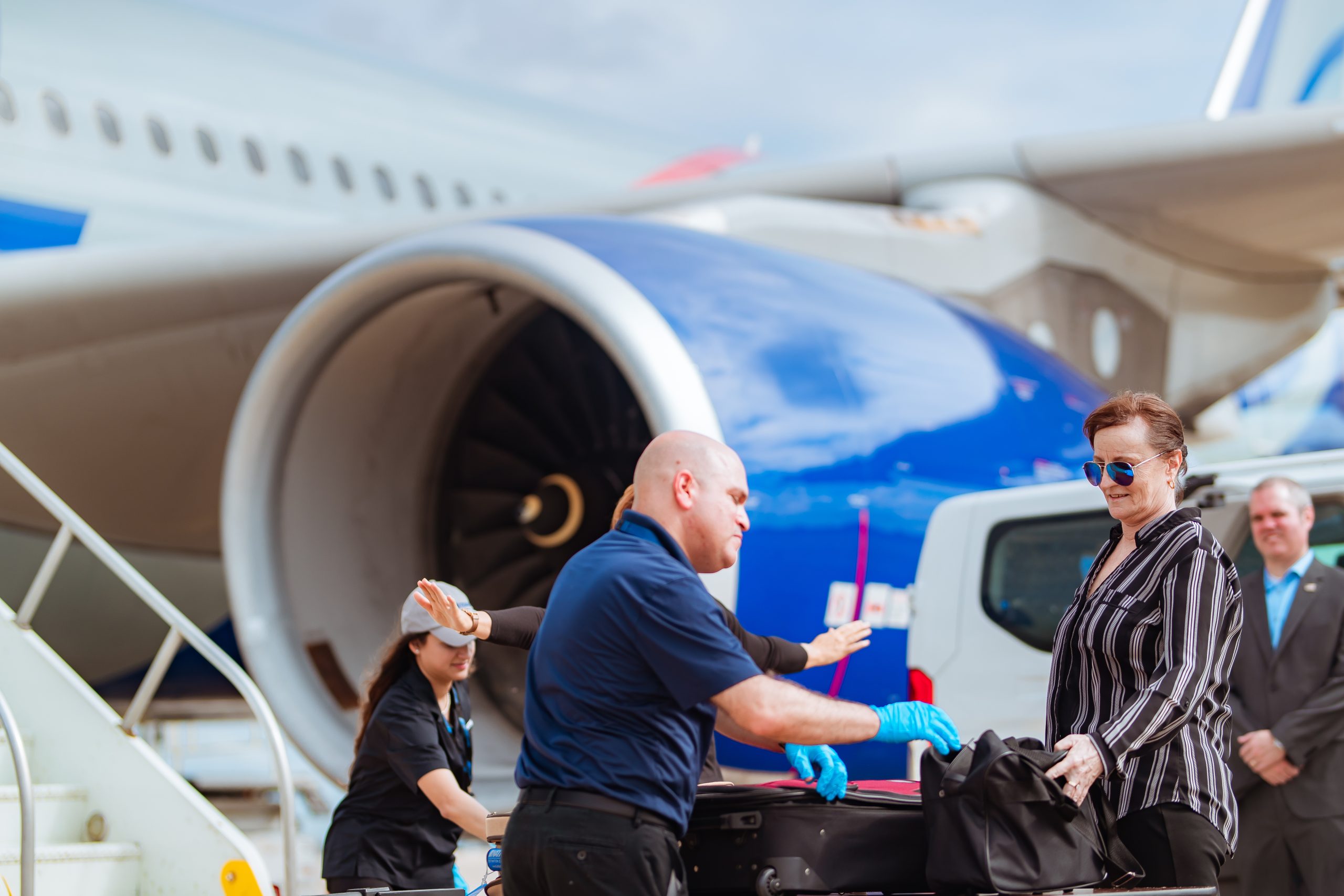 Workers beside an airplane