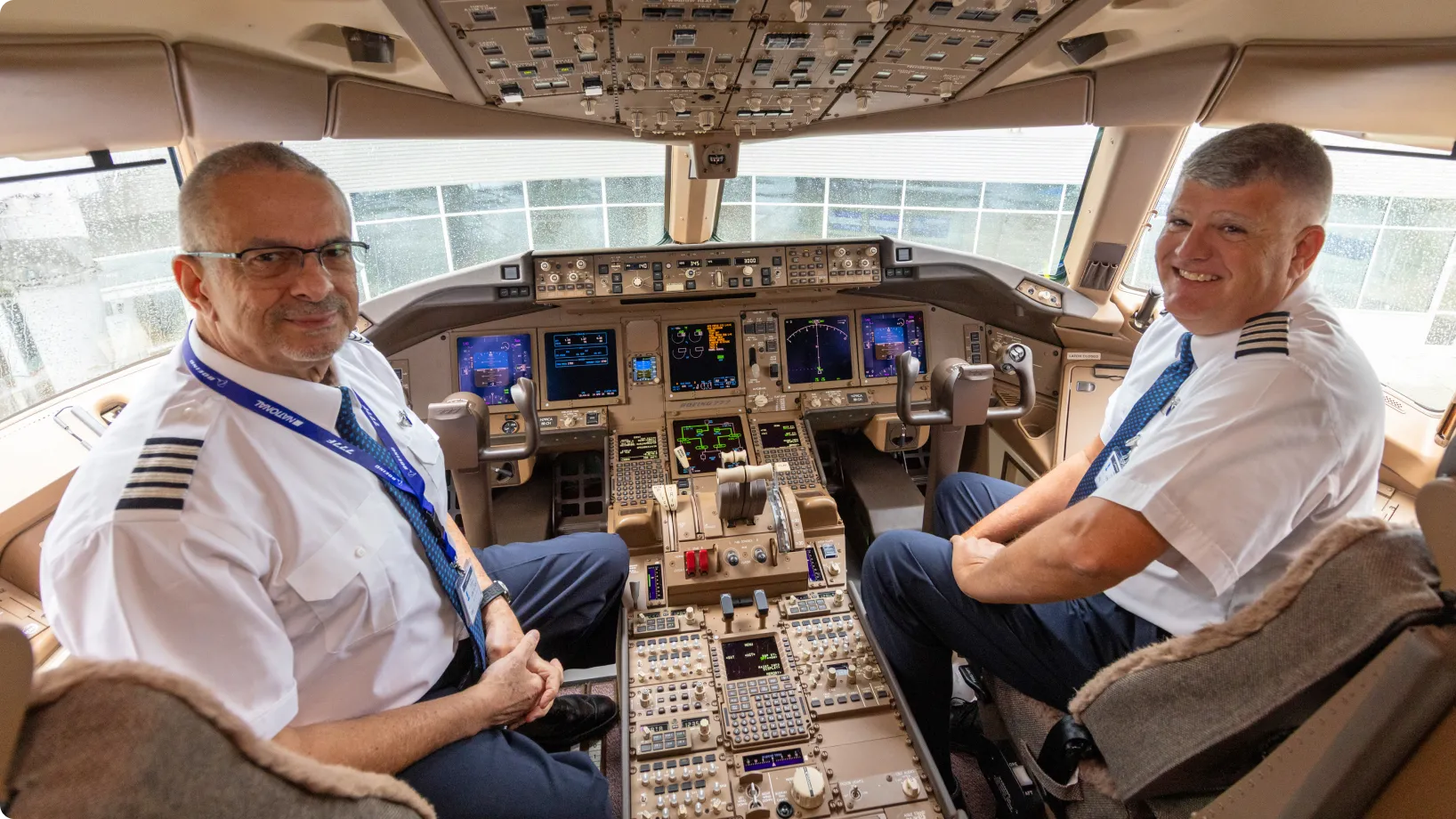 Pilot and copilot in cockpit of airplane